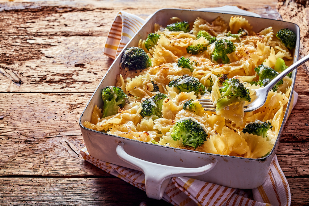 Italian pasta with fresh broccoli florets in cheese sauce