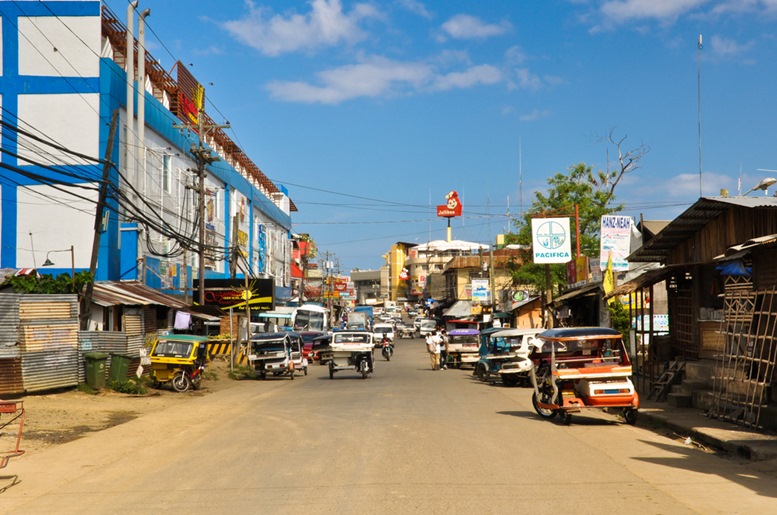 Streets full of tricycle taxis in Puerto Princesa, Philippines.